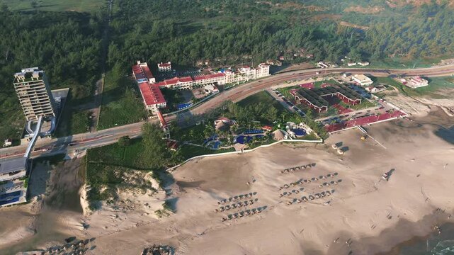 Panoramic Aerial Drone View Sliding Right Over Club Maeva Miramar Resort and Governors Park Surrounded by Lush Forest and Beach During a Peaceful Morning in Ciudad Madero Tamaulipas Mexico