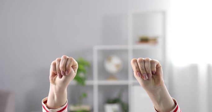 Woman showing signal for help at home, closeup