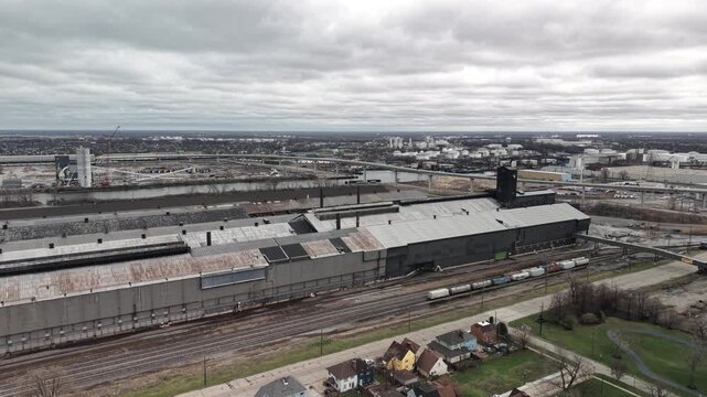 Aerial view of industrial train yard and Chicago cityscape