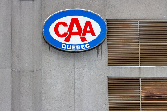 MONTREAL, CANADA, 25 December 2025 : CAA, Quebec, Sign, Concrete Wall, Horizontal Vents