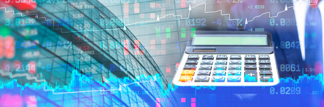 Panoramic banner featuring electronic calculating machine with abstract double exposure of corporate building and trading graphs. Concept fintech solutions, big data analytics and banking investment.