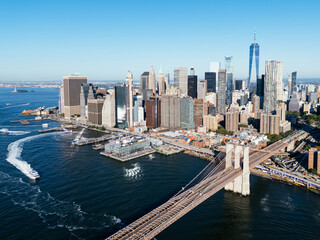 Fototapeta premium Aerial skyline of Lower Manhattan with Brooklyn Bridge and One World Trade Center, New York City waterfront. g.
