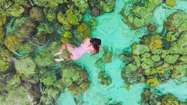 Drone close-up, Malwawey Coral Garden, Coron, peaceful snorkeling above reef