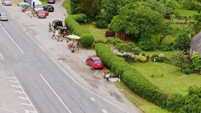 Local roadside market, Biksti, Latvia during midsummer - people and festive mood