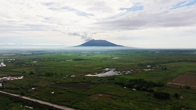 Aerial shot, Mount Arayat, Pampanga - farmland, wetlands and distant volcano