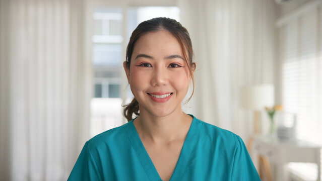 Young adult woman asia people anti aging expert modern nurse happy smile worker live home video call screen selfie look at camera mental health care Online digital virtual asian tele consult clinic.