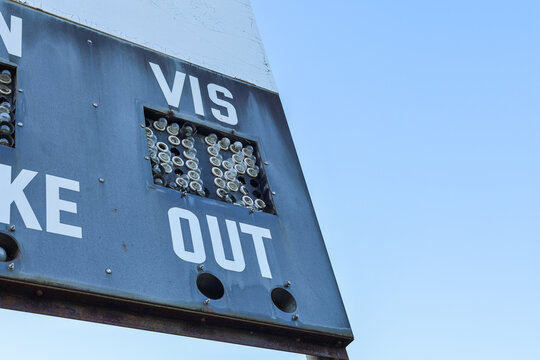Close-Up of Weathered Ballfield Scoreboard Corner with Broken Lights