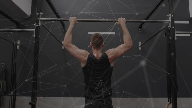 Man gripping pull-up bar initiating pull-up for fitness with network overlay mapping muscle