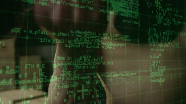 Green grid and code appearing, male shifting torso while overlay scrolling, mapping code onto body