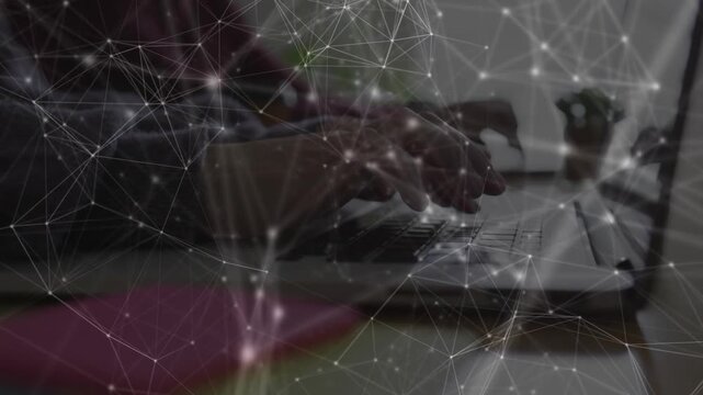 Left person touching keys, pair typing on laptops network lines pulsing then calming for tech work