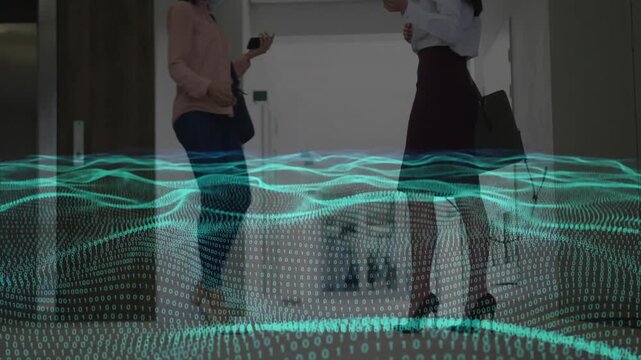 Woman on left raising smartphone, sharing info with peer in business hall, teal waveform over feet