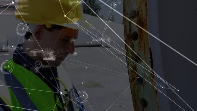 HUD linking tablet and beam construction worker inspecting rusted steel tapping tablet logging data