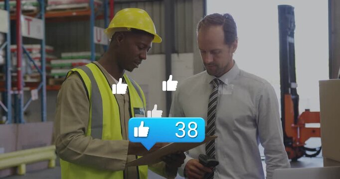 Warehouse lead pointing at board with scanner, worker checking stock, likes above pair hitting 77