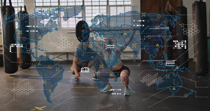 Woman lowering into overhead squat on trainer cue for depth, fitness map overlay tracking bar path