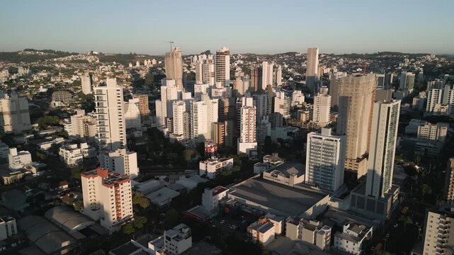 Drone footage of  buildings at sunset in downtown Chapec&oacute;.