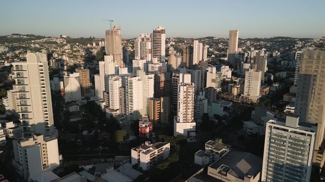 Drone footage of  buildings at sunset in downtown Chapec&oacute;.