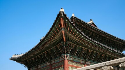 Obraz premium Traditional Korean Palace Roof Against Blue Sky