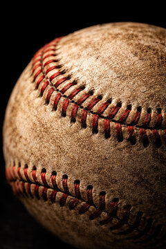 Close-up of an Old Baseball with Red Stitches