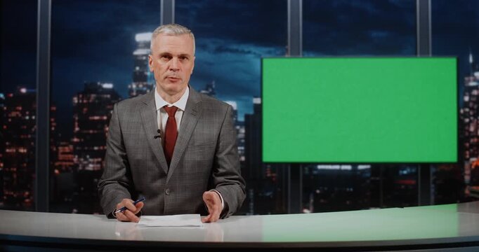 Professional Host of Leading Science Channel Conducts Broadcast in Modern Studio. Features Green Chroma Key Screen For Displaying Graphics and Infographics to Explain Complex Technological Topics.