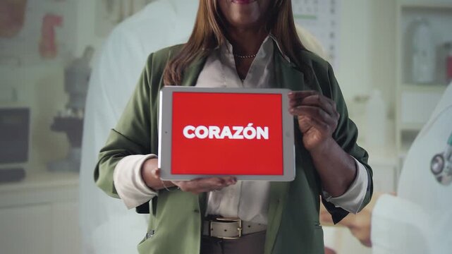 Zoom-in of a woman holding a &ldquo;Coraz&oacute;n&rdquo; sign, with background transitions showing nature, agriculture, love and care, conveying warmth and connection.