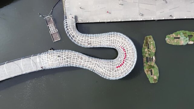 Aerial top down view of Webb Bridge pedestrian walkway over Yarra River in Melbourne Australia