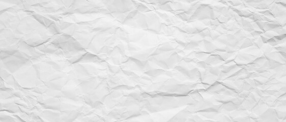 Obraz premium white crumpled paper grain texture , white background with an abstract, patterned texture reminiscent of decaying paper, soft fabric, or fine sand dunes, blank glued creased paper sheet