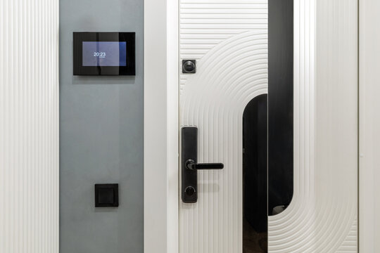 Smart Home Entrance with Digital Intercom and White Door