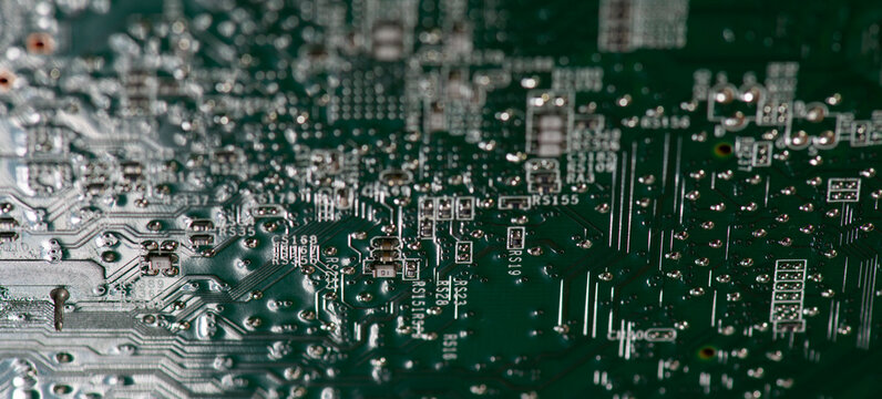 Circuit board with microelectronics surface. Circuit board in close-up macro. Circuit board for digital technology. Circuit board as pcb background.