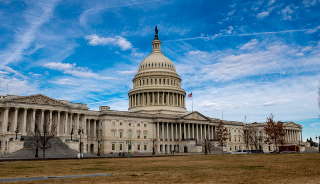 Capitol monument skyline cloudy. Capitol exterior in Washington DC. Congress governance Senate democracy. Capitol historic facade Capitol.