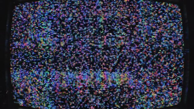 Glitch noise static with television screen effect concept. Close up of colorful pixelated television static noise screen with vibrant digital glitch pattern