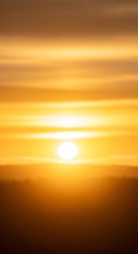 Beautiful golden sunset sky with soft glowing light.