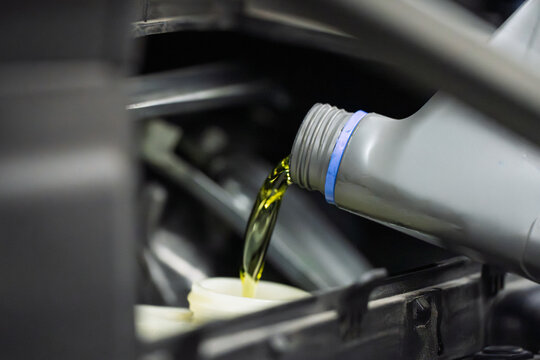 Fresh oil being poured into the engine