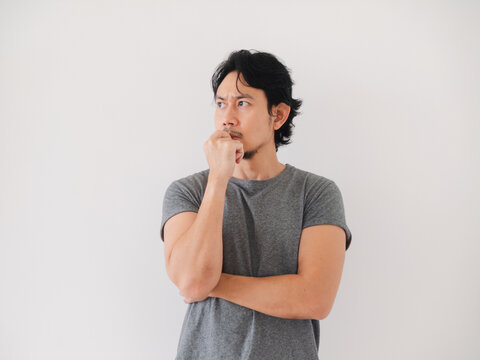 Reaction of Asian man thinking and trying to fix the problem seriously.