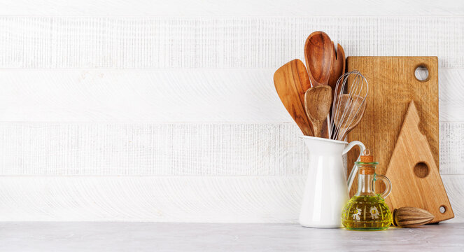 Kitchen utensils and spices on table