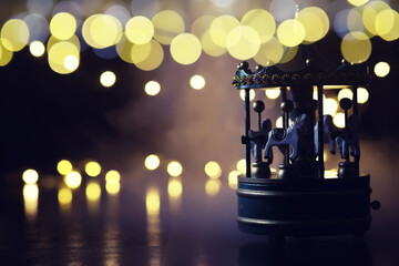 Horses on a Merry Go Round Carousel fun time Christmas night time © alexkich