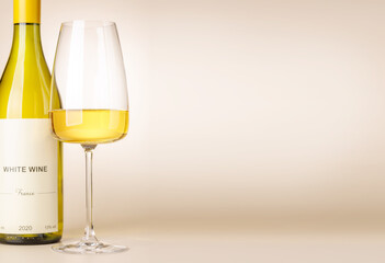 Fototapeta premium White wine bottle mockup with glass