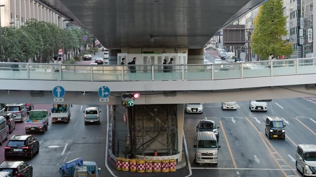 Tokyo Scene : Busy Urban Arterial Road with Pedestrian Overpasses Above and Elevated Highways Running Higher, Creating a Multi-Layered Urbanscape | Shibuya Station West, Shibuya, Tokyo, Japan