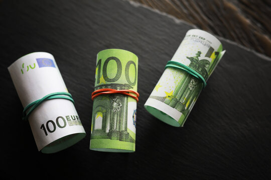 100 euro banknote pack and wood bankground. Currency, financial