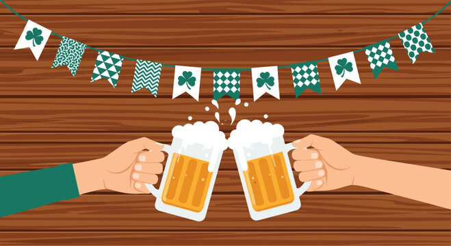 Two hands clink large frothy beer mugs in celebration under green shamrock and checkered bunting on wooden wall.