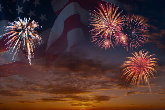 National flag of United States of America in sky with fireworks independence day