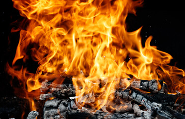 Fototapeta premium A large pile of burning wood with a lot of flames