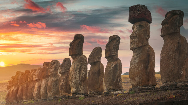 Moai Statues at Ahu Tongariki Easter Island under Sunset Sky with Copy Space