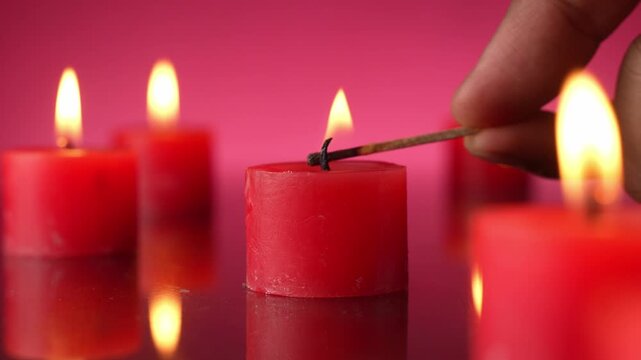 Red small Candles Are Blown up In A Dark red Room
