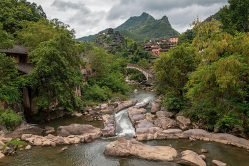 Mountain village along a rocky river gorge in Wangxian Valley, Shangrao, Jiangxi, China