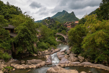 Mountain village along a rocky river gorge in Wangxian Valley, Shangrao, Jiangxi, China