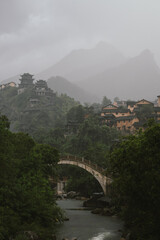 Mountain village along a rocky river gorge in Wangxian Valley, Shangrao, Jiangxi, China