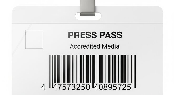 Close-up of a white plastic press pass identification badge with "Accredited Media" text and a large barcode.
