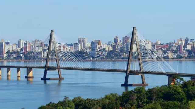San Roque Gonz&aacute;lez de Santa Cruz international bridge with urban skyline of Posadas in the background near the Paran&aacute; River.
