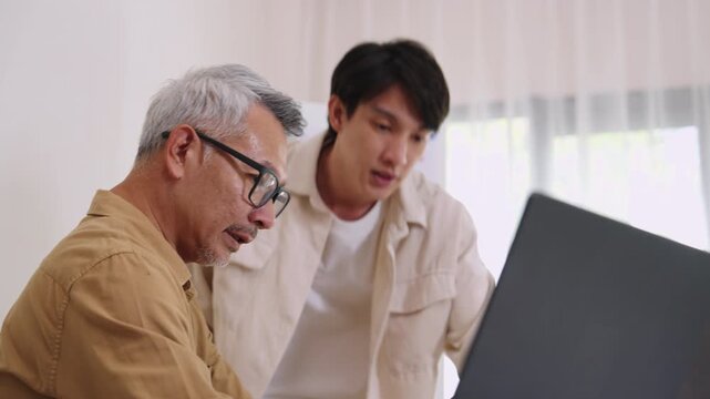 Asian senior bootcamp team asking and  learning programming with software training and whiteboard collaboration