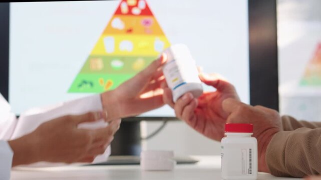 Doctor Explaining Medication to Senior Patient During Medical Consultation